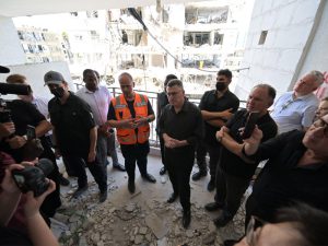 FM Sa’ar briefs foreign ambassadors at the site of the Iranian ballistic missile attack in Bat Yam
