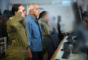 The siren of remembrance was activated by a second-generation Holocaust survivor and his granddaughter, an IDF officer.