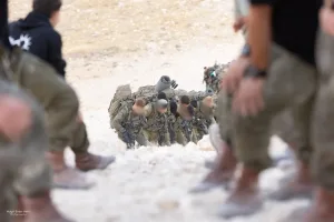 Even when the slope is impossible, the hand of a Haruv reconnaissance unit soldier will push you to the summit.